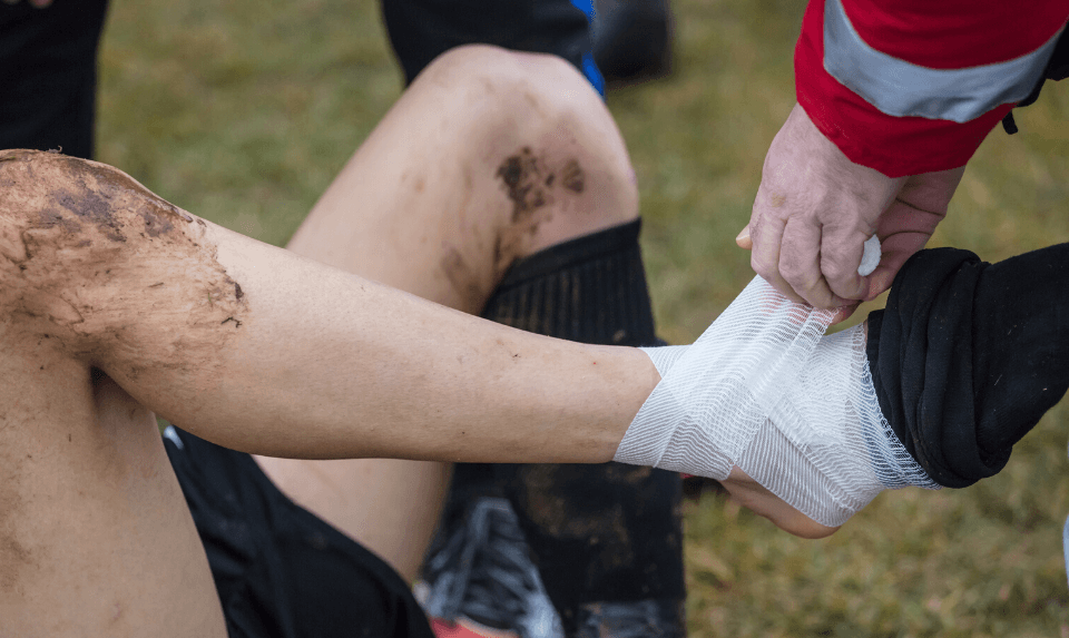 athlete being treated by an athletic physical therapist